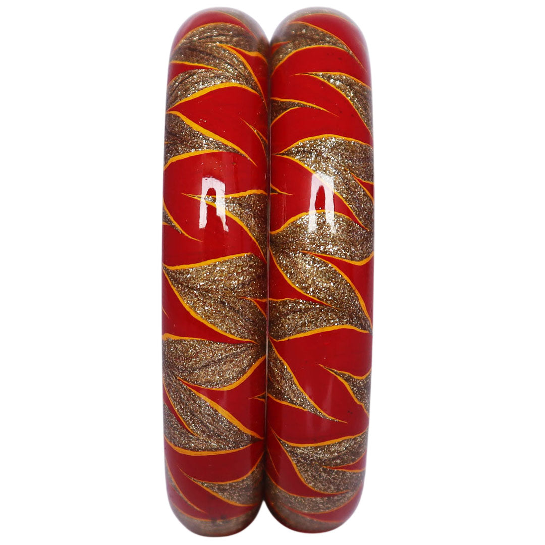 Designer lac bangles set with red and golden swirl pattern