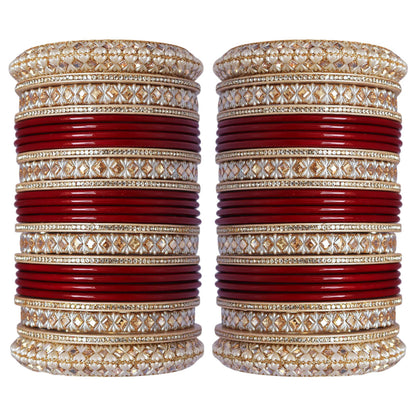 Punjabi-style bridal bangles with ivory-toned decorative patterns and gold-tone embellishments.