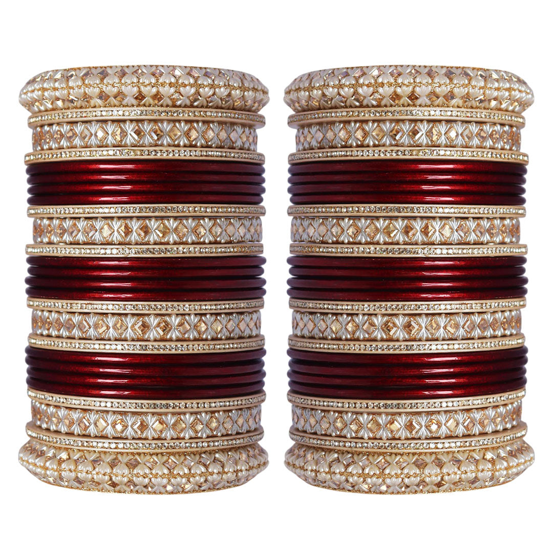 Maroon and red Punjabi-style bridal bangles set with Kundan-style decorative work by Taj Bridal Store.