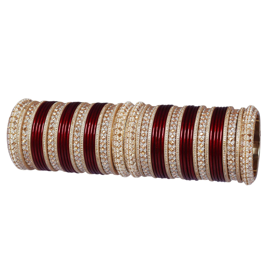 Traditional Punjabi bridal chooda with maroon and red bangles and intricate Kundan-style design.