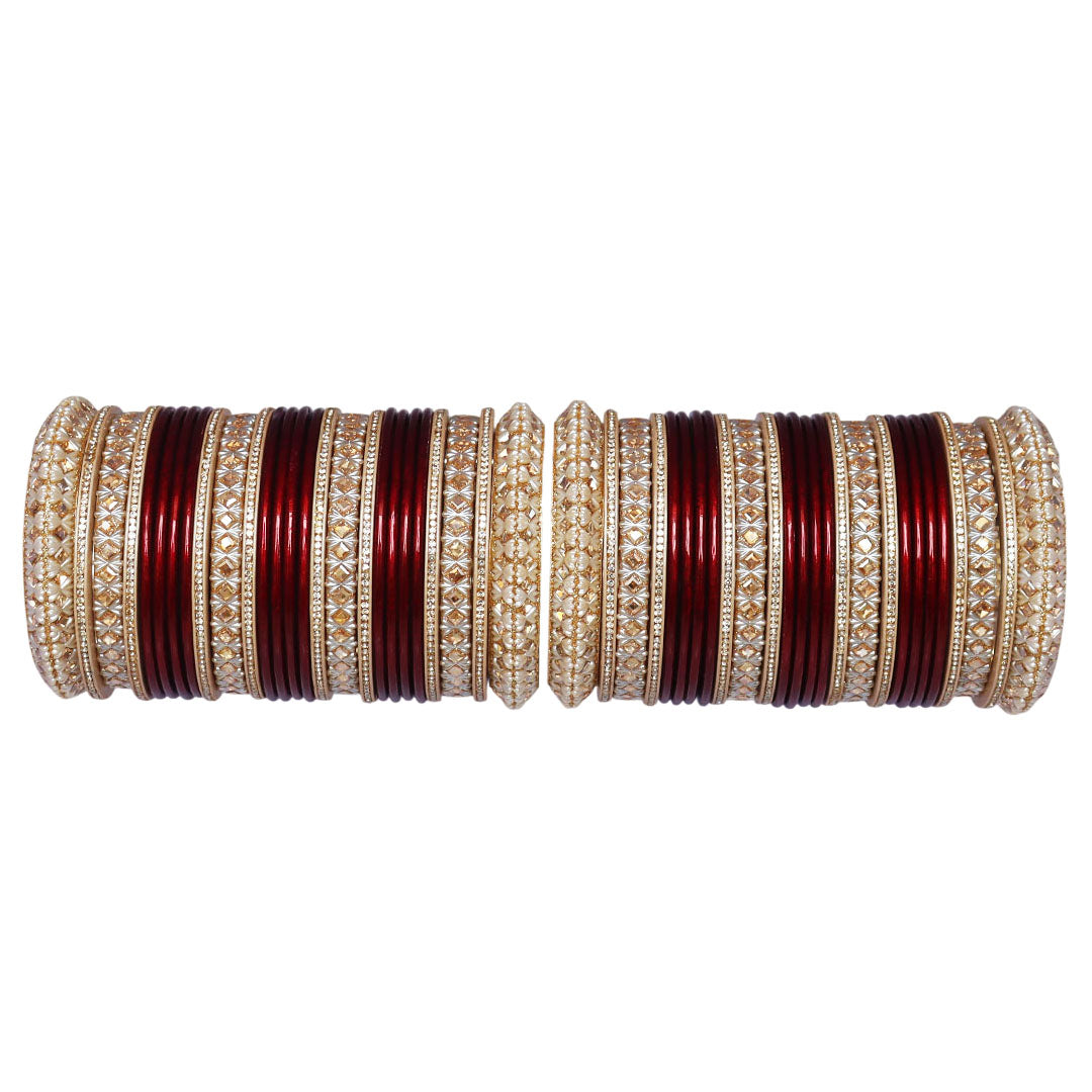 Premium maroon and red bridal chooda set featuring ivory-toned patterns and gold-tone detailing.