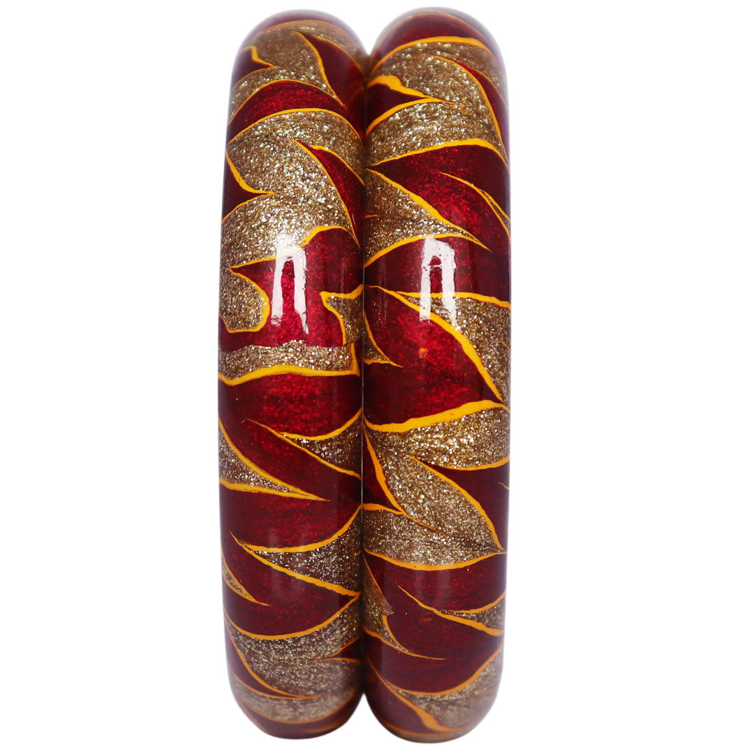 Rajasthani designer lac bangles with glittery golden swirl detailing