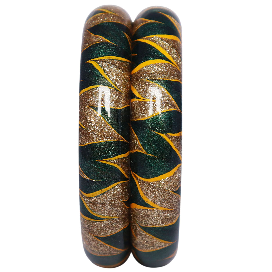 Traditional Indian lac bangles with glittery golden detailing